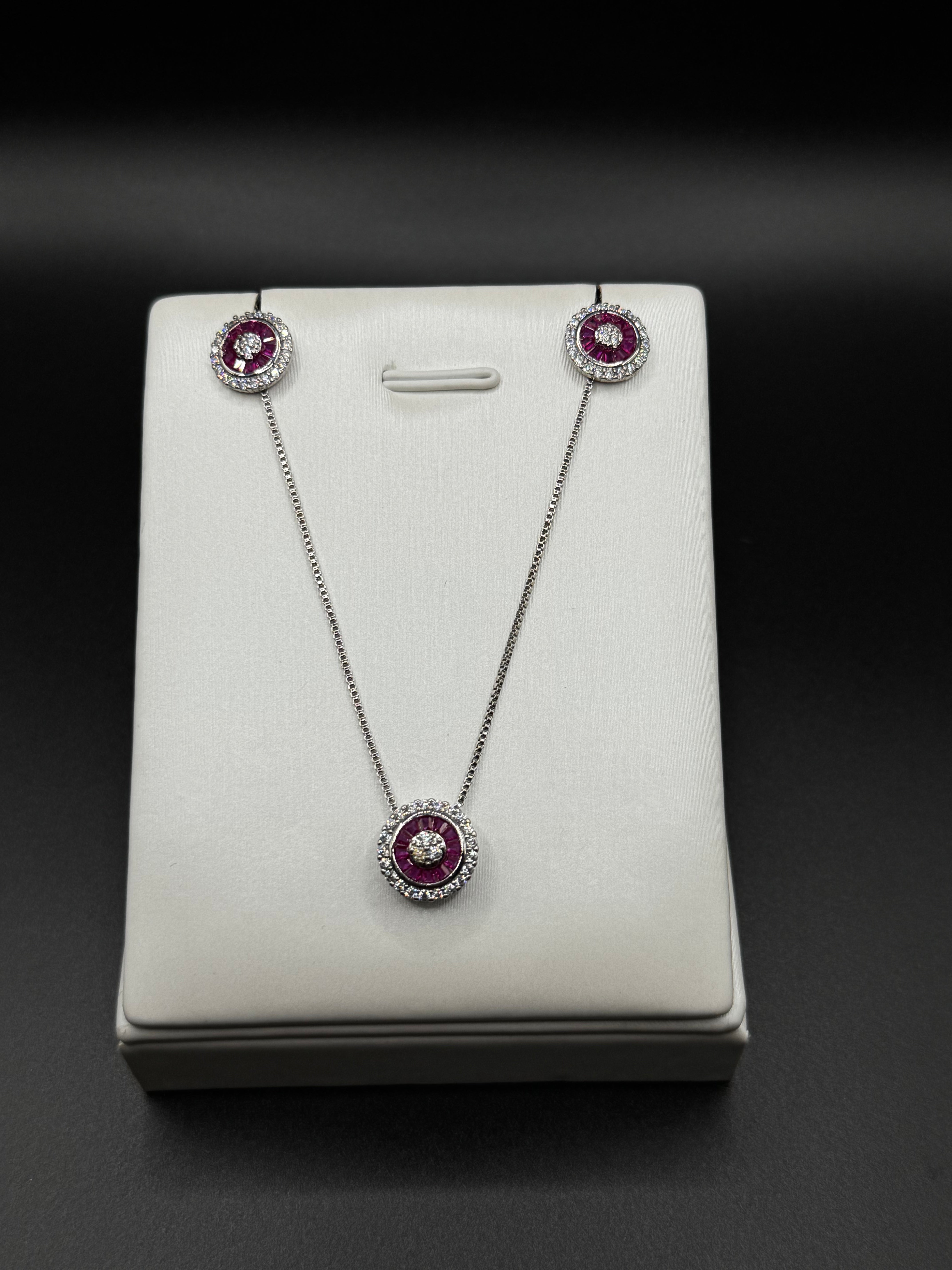 Set in rhodium plating with pink zirconia