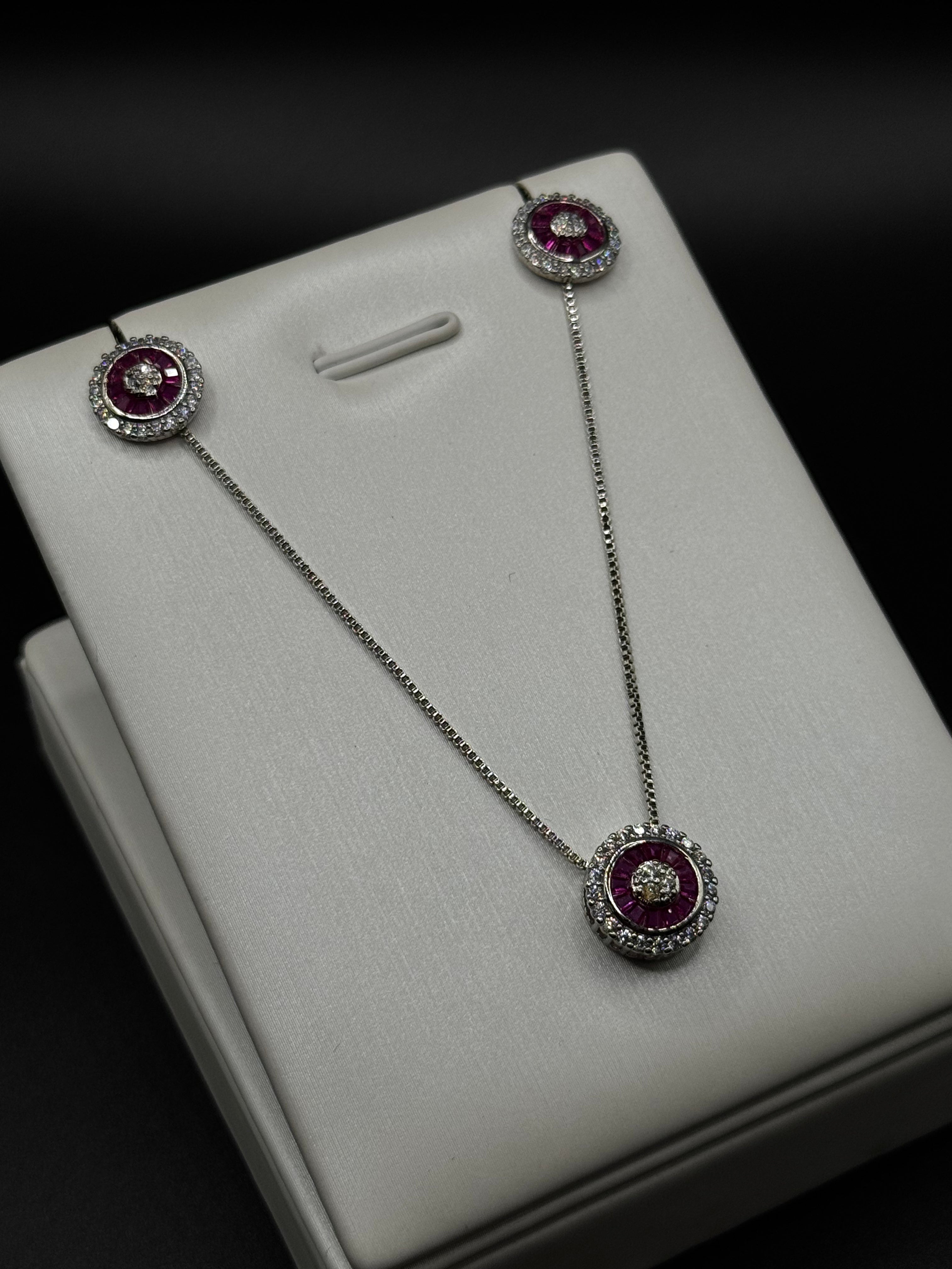 Set in rhodium plating with pink zirconia