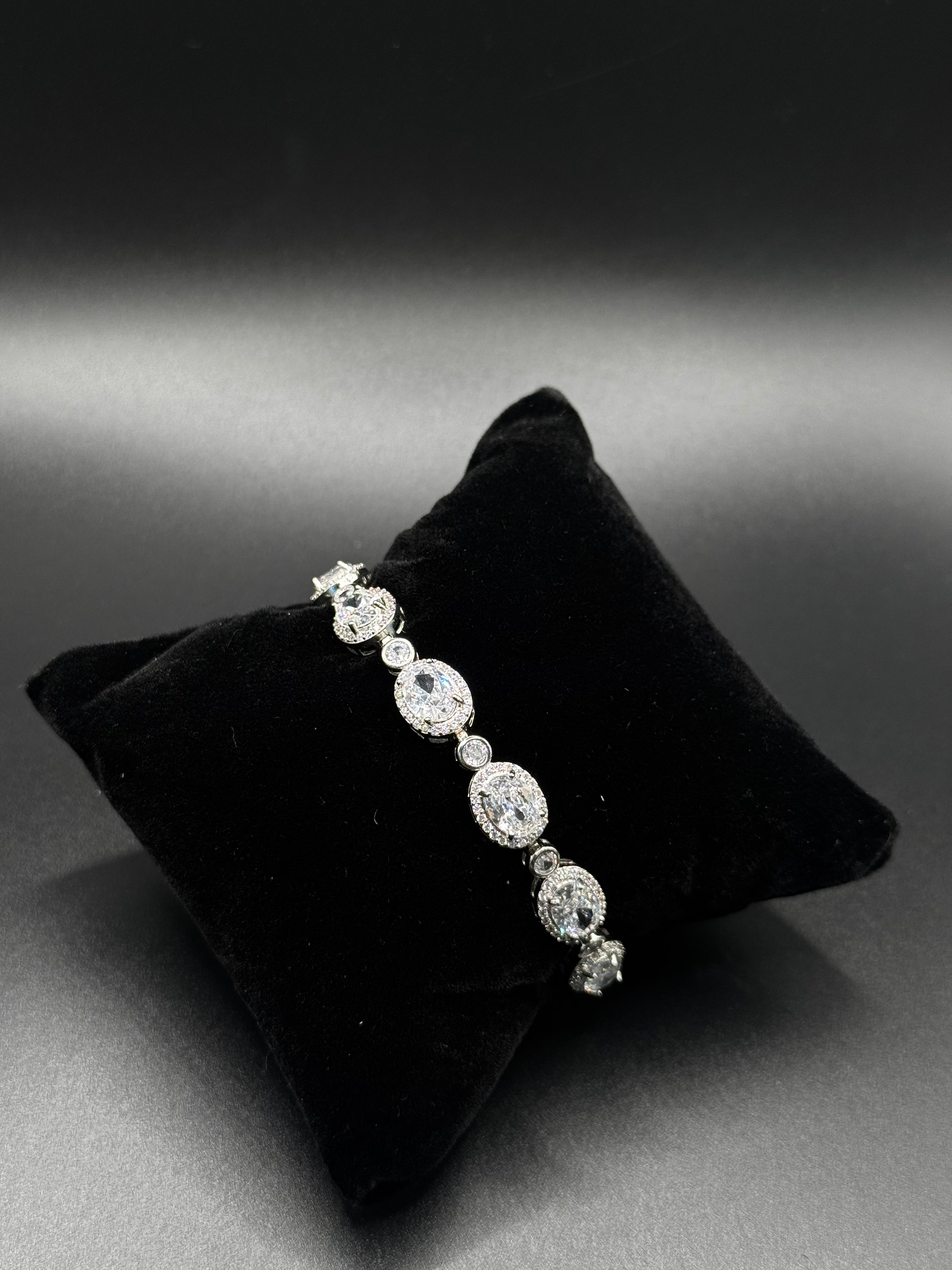 Rhodium-plated bracelet with clear oval zirconia stones