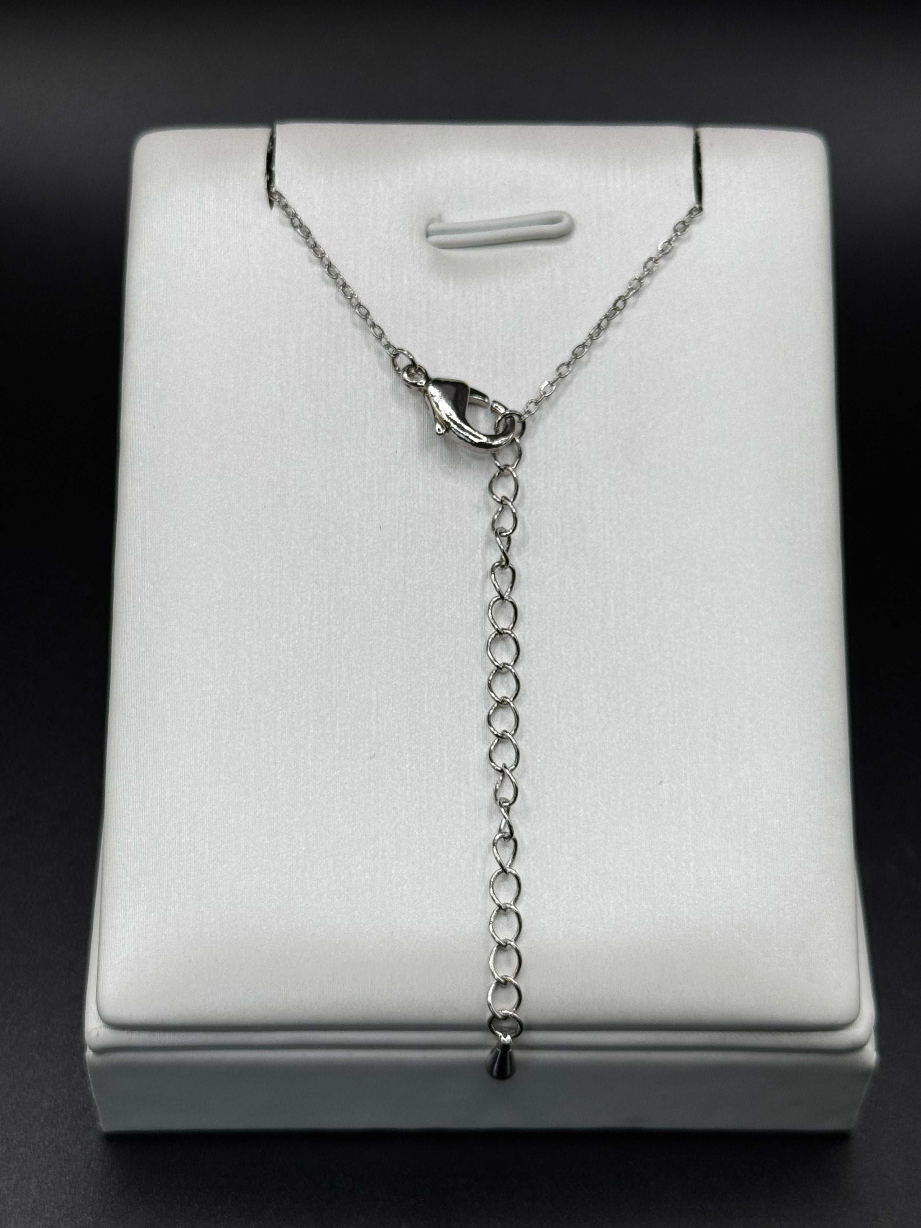 Rhodium-plated jewelry set with a heart-shaped crystal pendant