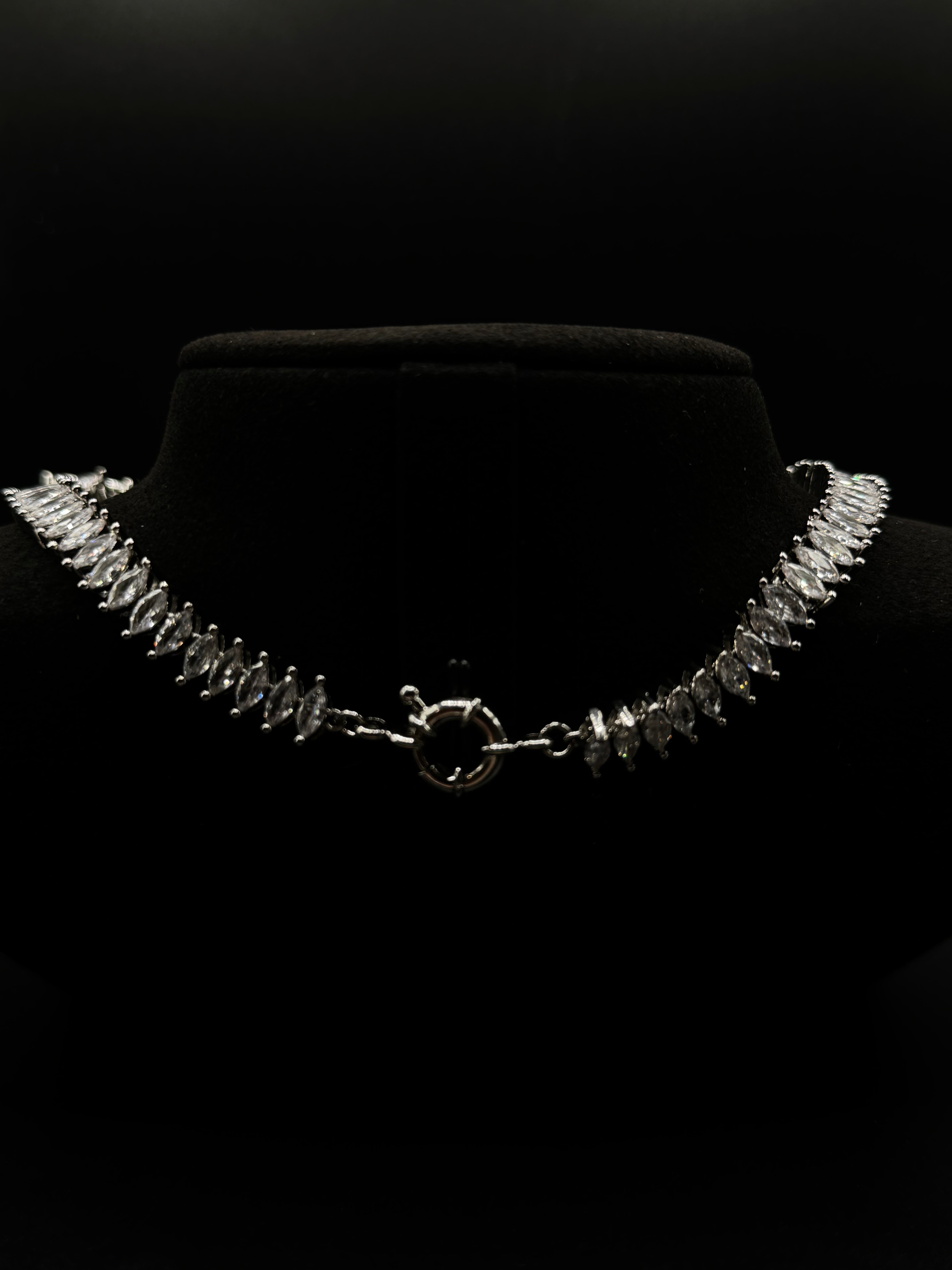 Luxury jewelry set fully encrusted with clear zirconia , featuring a ruby fusion stone pendant"