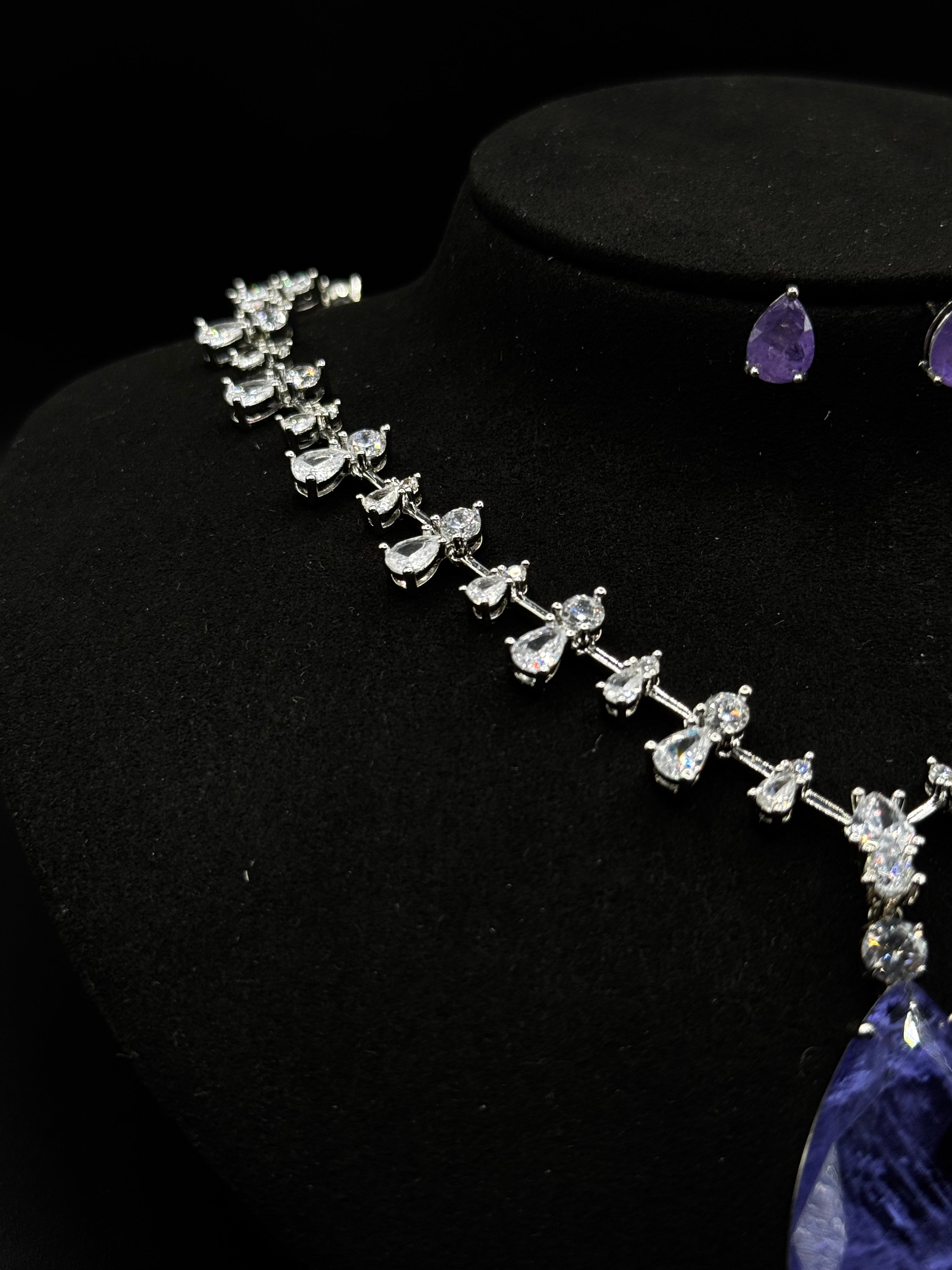 Luxury rhodium-plated jewelry set with a teardrop-shaped amethyst fusion stone pendant