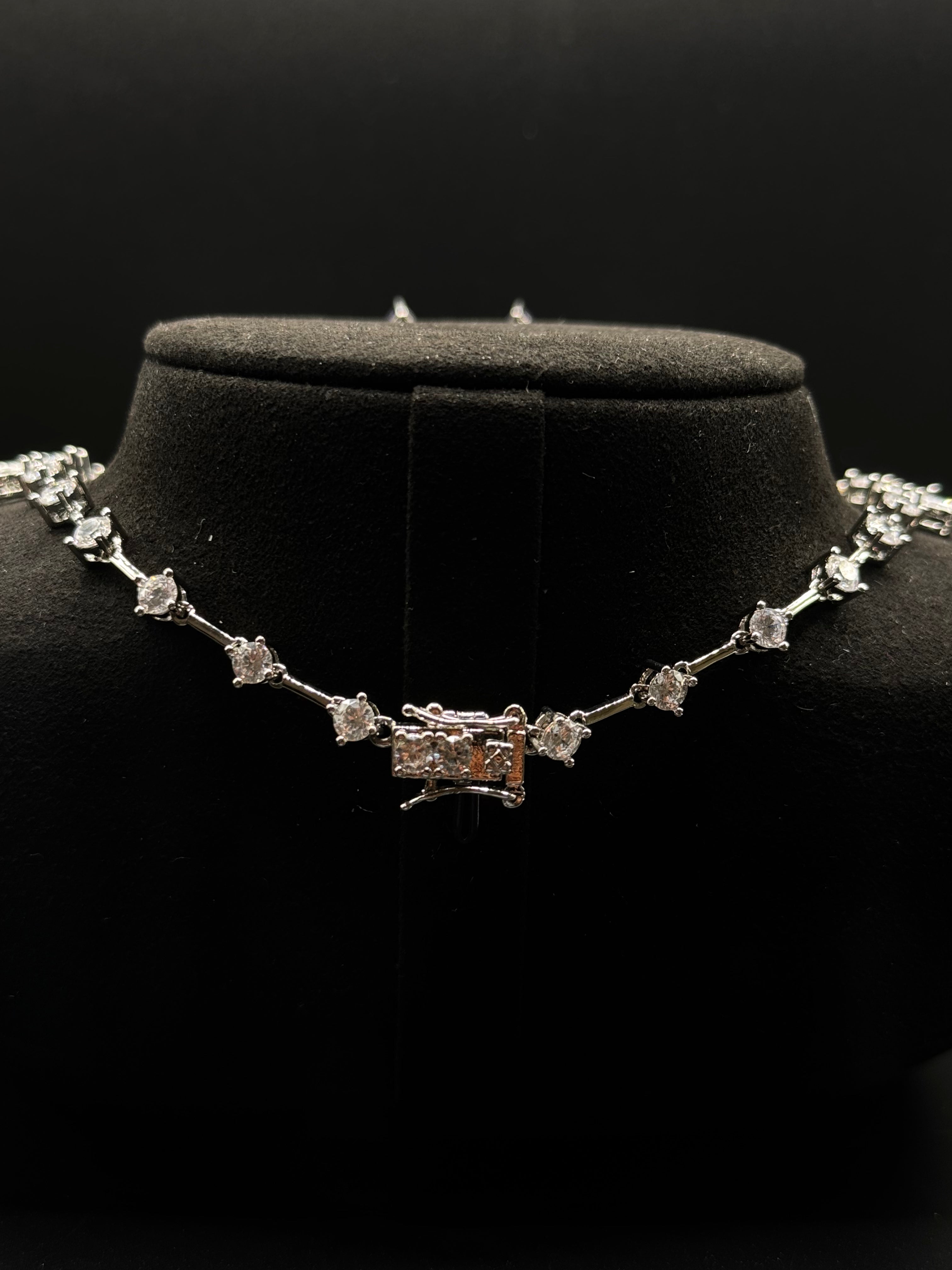 Luxury rhodium-plated jewelry set with a teardrop-shaped amethyst fusion stone pendant